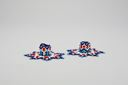 Image of Candleholders with netted beadwork with blue, white, navy, red. 7 pointed star